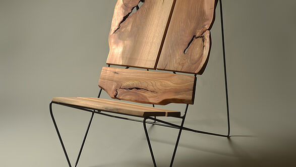 Designer armchair made of natural wood