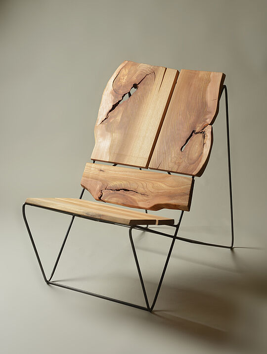Design armchair made of natural wood -